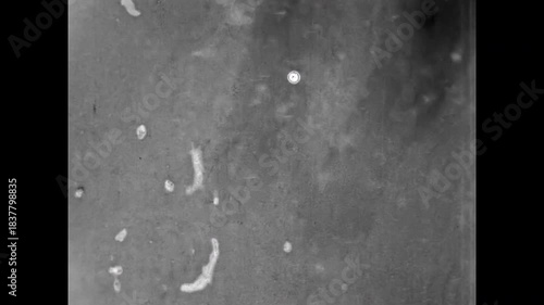 People playing hockey game on frozen ice river. Active fun leisure in cold winter. Amateur sport recreation in snow lake. Hockey skating in Vintage film. Old archive activity. Archival retro 1960s