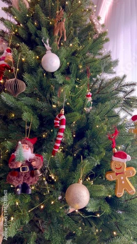 Cozy green Christmas tree at home decorated with fairy ornaments and glowing lights. Festive holiday atmosphere, warm interior, traditional New Year celebration, magical winter mood, family holiday 