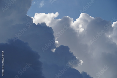 Stunning moody and fluffy clouds in a deep blue sky