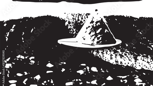 Desolate desert landscape with a lone hat resting on rocky ground under stark monochrome light.