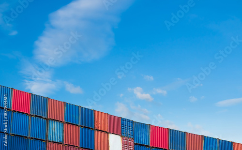Cargo ship container goods export import international transport on blue sky background, warehouse industry business logistics transportation harbor port industrial shipping terminal cargo ship.