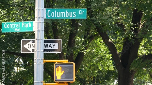 New York City Broadway street sign on Manhattan, United States. Urban road sign in american city. Traffic sign in Midtown of NYC USA. Traffic light near Columbus circle and Central Park. One way arrow