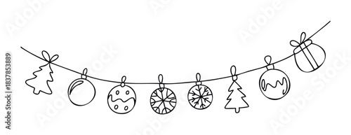Christmas garland with festive ornaments and trees strung on a wire, perfect for holiday greetings and seasonal decorations.
