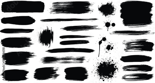 Collection of black paint brush strokes and splatters on white background