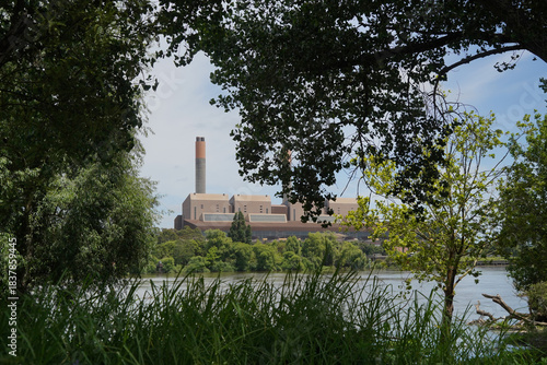 A view of Huntly Power Station through the trees in summer