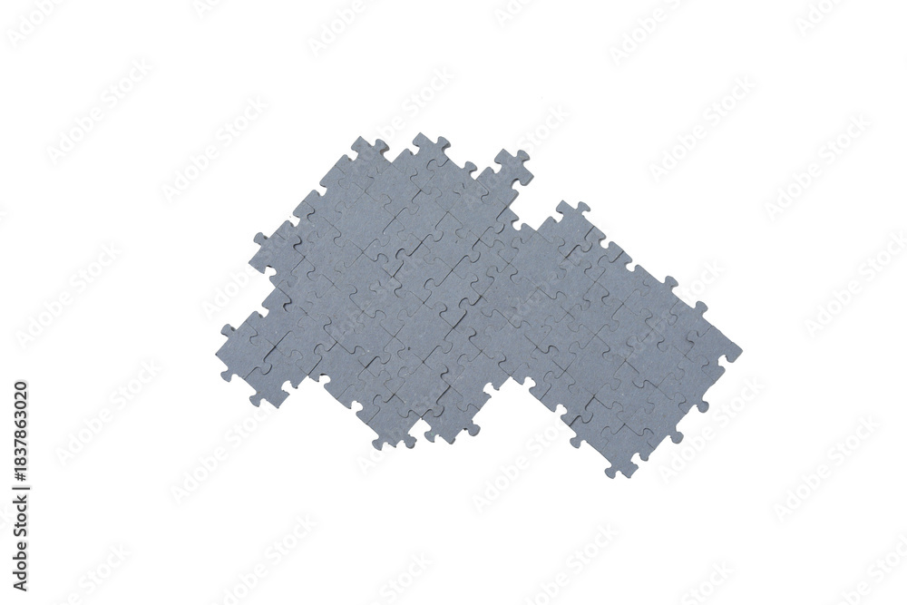 Fototapeta premium Scattered puzzles on a white background with selective focus. 