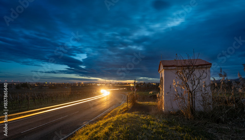 Fototapeta Naklejka Na Ścianę i Meble -  small chapel at sundown, Weinbergstrasse near Pfaffstätten in Lower Austria