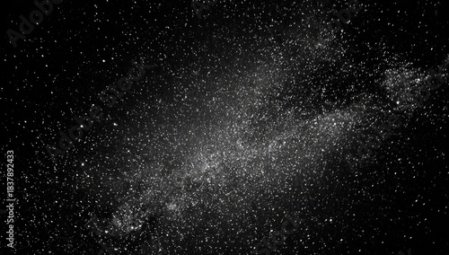 A stunning grayscale image of the Milky Way, showcasing a vast expanse of stars and celestial dust