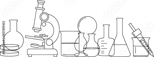 A collection of scientific laboratory equipment including a microscope and various glass containers science