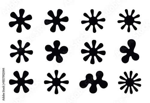 Collection of twelve abstract black starburst and blob shapes, perfect for graphic overlays, abstract backgrounds, and playful modern applications.