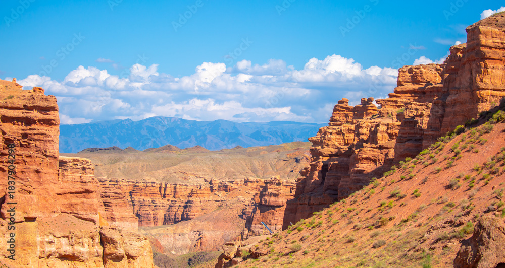 Fototapeta premium Charyn Canyon, Valley of Castles. The excellence of Kazakhstan. Panorama of natural unusual landscape. The red canyon of extraordinary beauty looks like a Martian landscape.