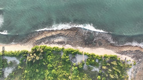 Aerial view of rocky shoreline and turquoise waves at Saint Martin, Teknaf, Cox’s Bazar, Bangladesh - 4k aerial video shot