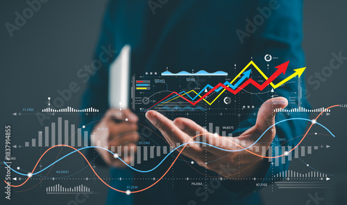 A professional analyzing data trends with hands raised, showcasing vibrant graphs and charts indicating growth and analytics.