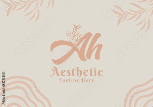 Brush style Ah initial letter logo with aesthetic leaf accents