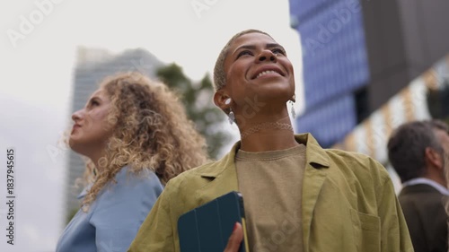 Diverse group of people looking up with awe and inspiration