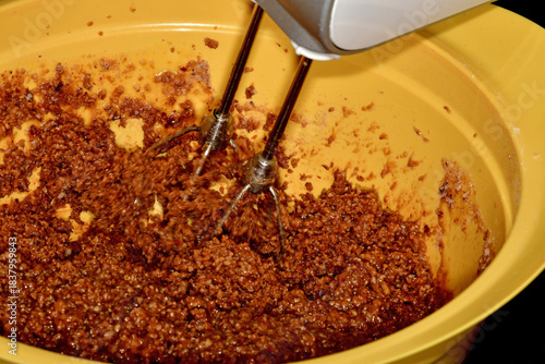 German Christmas bakery, mixing a dough for Lebkuchen