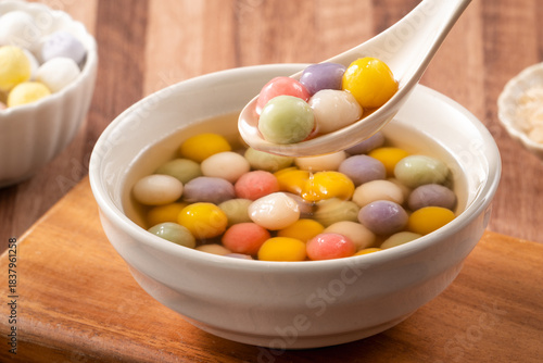 Colorful sweet glutinous rice balls tangyuan in sweet ginger syrup soup