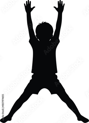Silhouette of a child jumping with arms raised high