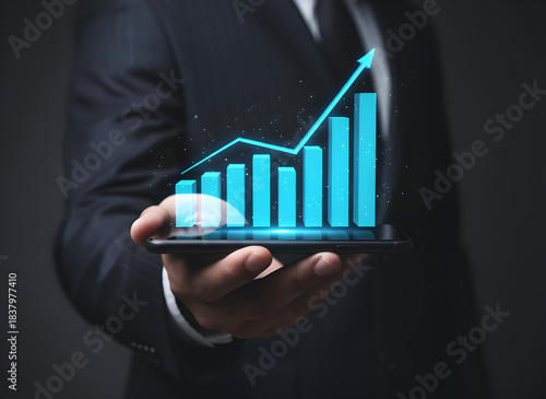 Businessman Holding Smartphone with Rising Holographic Bar Chart