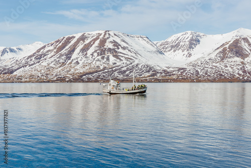 Cuadro en lienzo A small boat on the blue water of the Eyjafjörður fjord