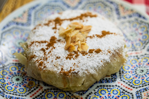 Moroccan pastilla, puff pastry filled with onion, chicken, parsley, and almonds with cinnamon, Tangier, Morocco, North Africa