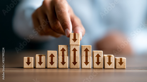 Wallpaper Mural Businessman hand holding wooden block with arrow growth concept success leadership strategy planning development progress motivation and improvement in workplace Torontodigital.ca