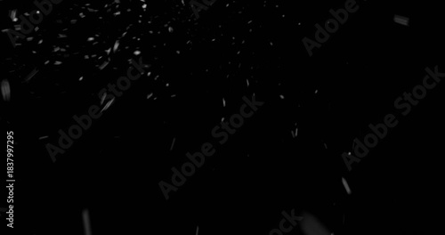 Slow Motion Footage of Falling Snow Captured with a High-speed Camera on a Pure Black Background. Perfect as a VFX or Compositing Overlay for Winter Atmospheres, Transitions, and Visual Effects.