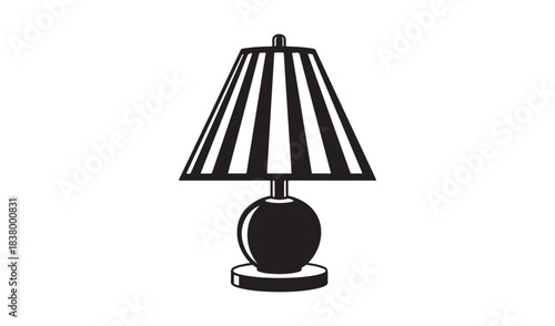 A classic electric table lamp with a shade and bulb isolated on a white background for home decor and interior design