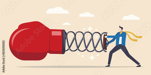 Man straining against a large spring connected to a boxing glove