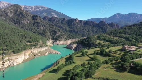 Wallpaper Mural Turquoise Llosa del Cavall Reservoir on Cardener River winding through picturesque mountainous landscape in Catalonia, Spain, surrounded by lush greenery and rocky cliffs under clear blue sky Torontodigital.ca