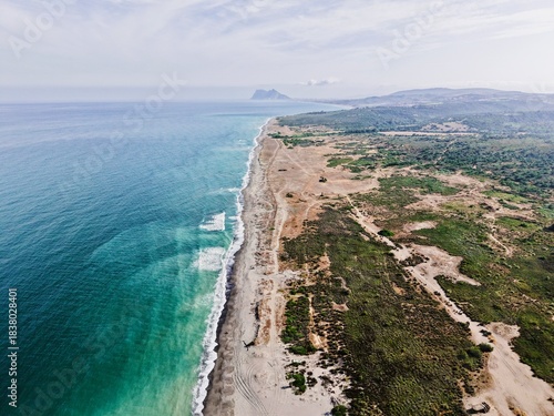 aerial view of the coastline between Sotogrande and La Alcaidesa with the Rock of Gibraltar behind it, rural landscape in Andalusia, Spain