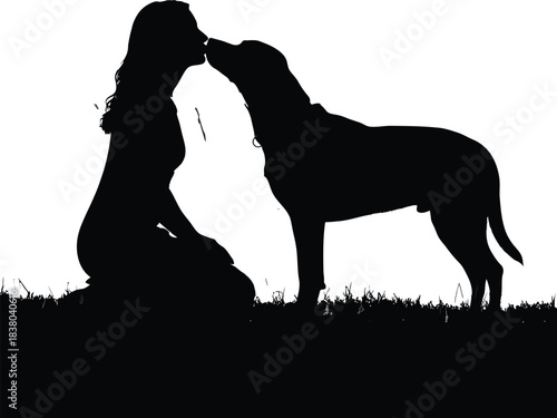 Silhouette of a woman kneeling and sharing a gentle moment with her dog on a grassy field against a white background