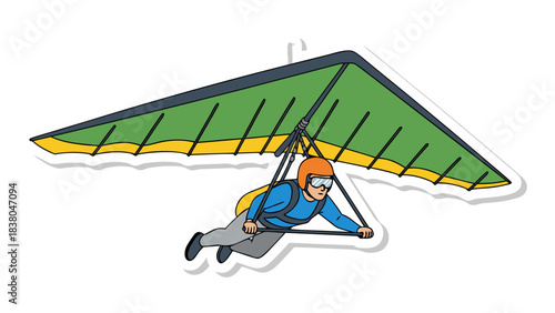 Man Soaring Through Sky on Green Hang Glider Wearing Blue Shirt and Orange Helmet Against a Black Background with White Border Emblematic of Adventure and Freedom