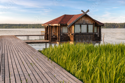 Gazebo on the shore of a pond on a summer evening