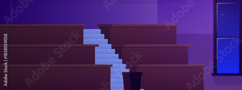 An empty lecture hall with wooden tables, stairs, a podium, and a window, viewed at night.
