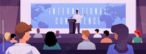 A lecture hall with a speaker on stage, a world map on the screen, and an audience.