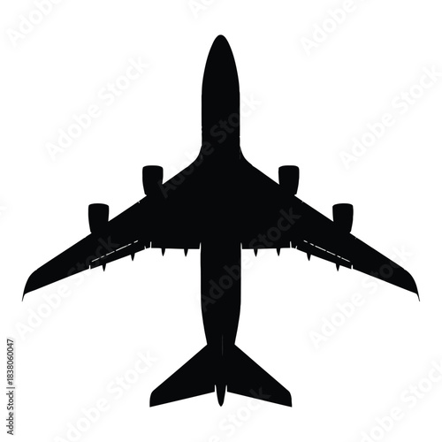 A striking silhouette of a large passenger airplane viewed from above