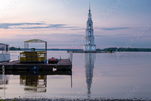 The flooded bell tower of St. Nicholas Cathedral rises above the surface of the Volga River. Kalyazin, Tver region.