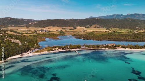Cinematic Aerial Approach Shot Flying Over Pristine White Sand Beach Towards Santa Giulia Lagoon and Turquoise Mediterranean Sea, Porto Vecchio, Corsica, France.