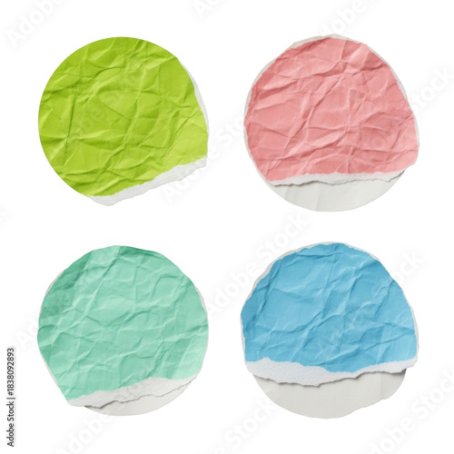 four separate, heavily textured, round vintage paper stickers in lime green, pastel pink, mint, and light blue, on a white background. concept for aged sticker mockups