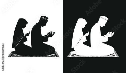 Monochrome silhouettes of two women in traditional islamic clothing praying