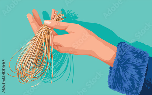 Hand holding dried noodles against a blue background