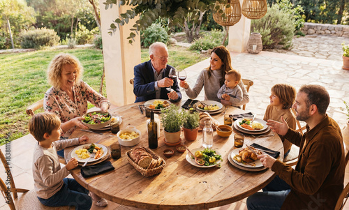 Happy family during garden lunch