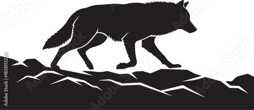 Black Silhouette of a Wolf Walking on Rocky Terrain