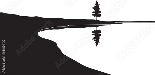 Silhouette of a lone tree reflected in calm water reflection