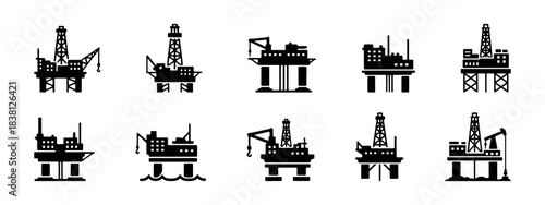 A collection of offshore oil rig platforms in black silhouette, depicting various designs and structures.
