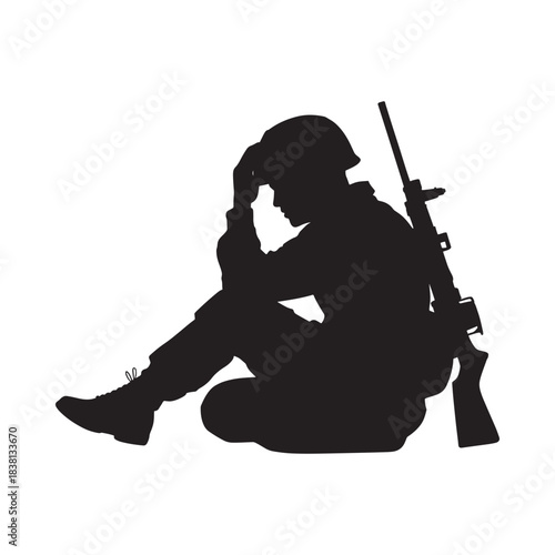Silhouette of a soldier sitting with head in hands and rifle