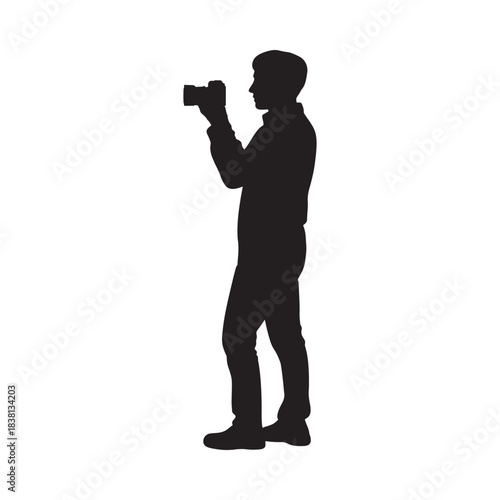 Silhouette of a photographer taking a picture side profile view