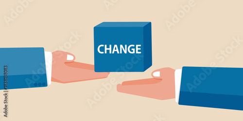 Hands exchanging a blue block with the word change written on it