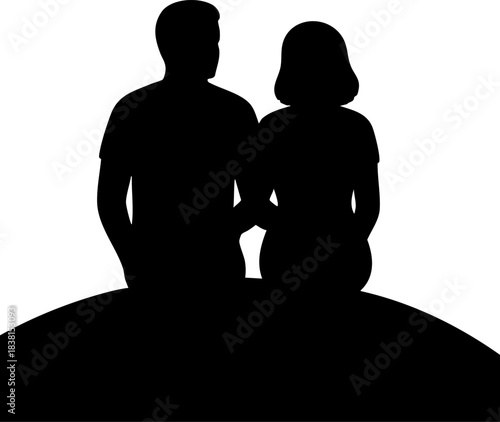 Silhouette of couple sitting together on hilltop in peaceful moment